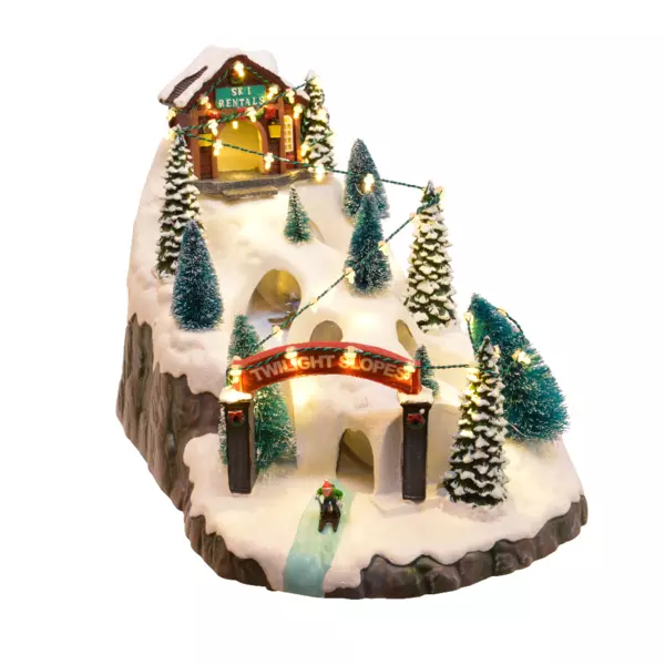 Beleuchtete Weihnachtsdorf-Szene Skipiste