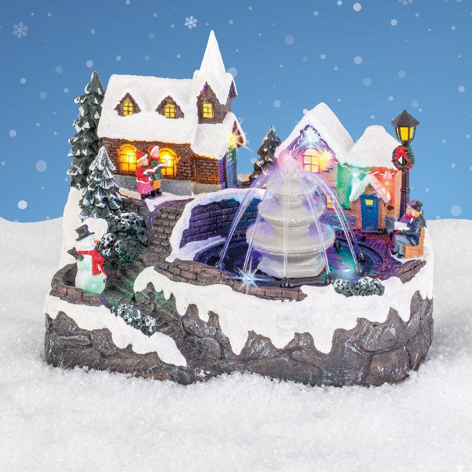 Villaggio di Natale luminoso e musicale Fontana illuminata 1
