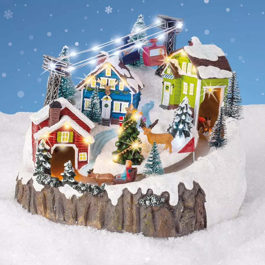 Pueblo de Navidad luminoso y musical vacaciones en la nieve 1