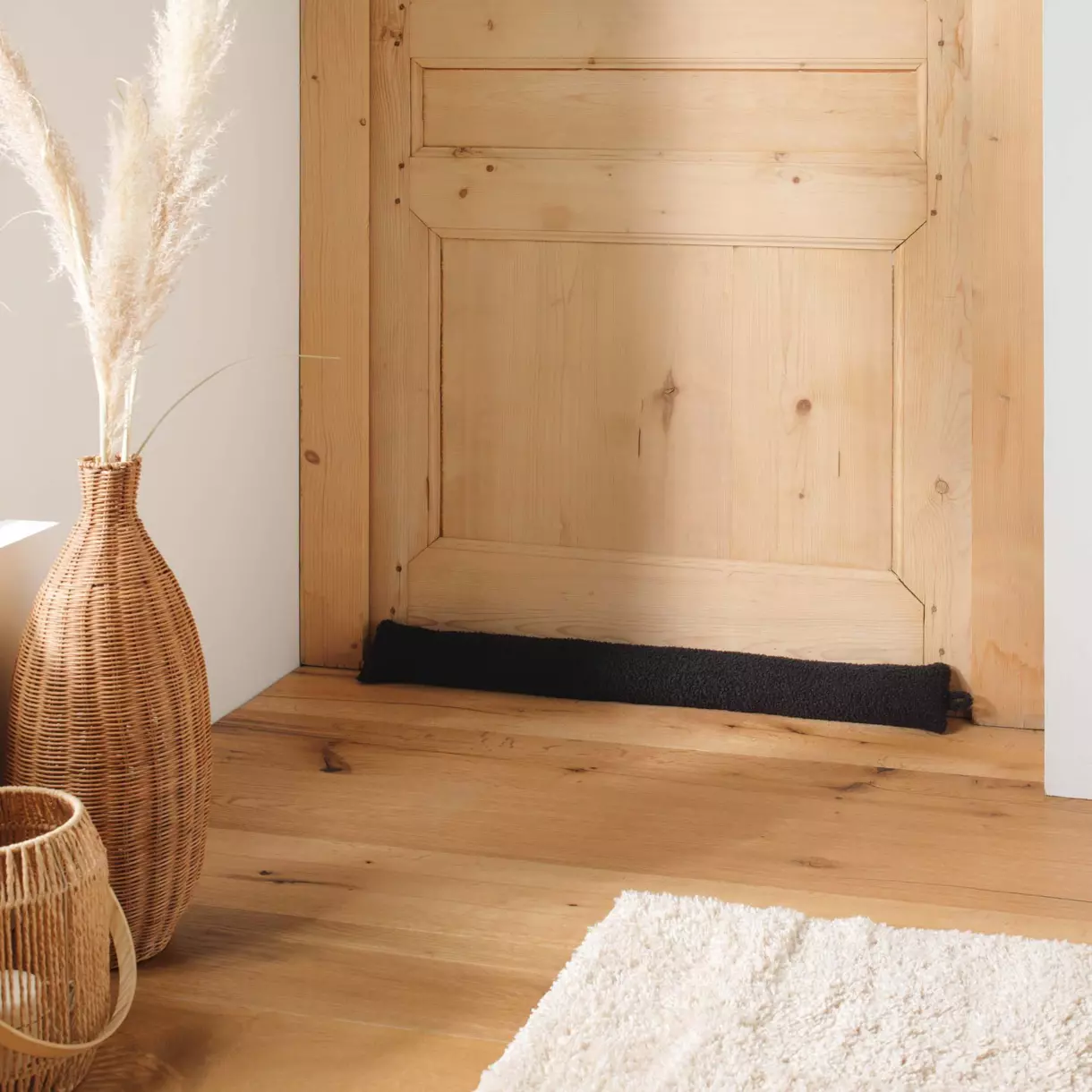 Coussin bas de porte bouclette Wooly Noir