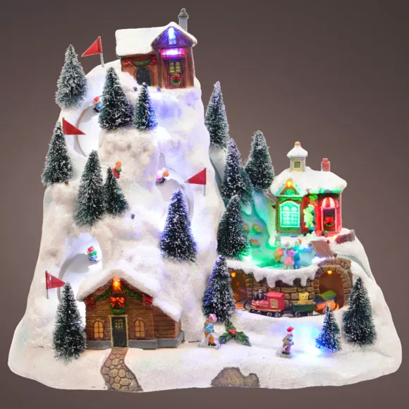 Verlicht en muzikaal Kerstdorp Geanimeerd skistation