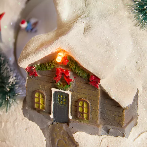 Verlicht en muzikaal Kerstdorp Geanimeerd skistation