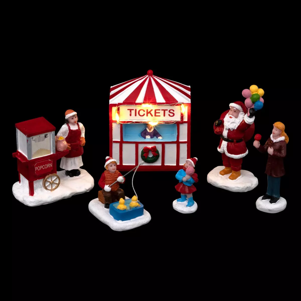 Lot de figurines et accessoires Fête foraine du Père Noël pour village 1