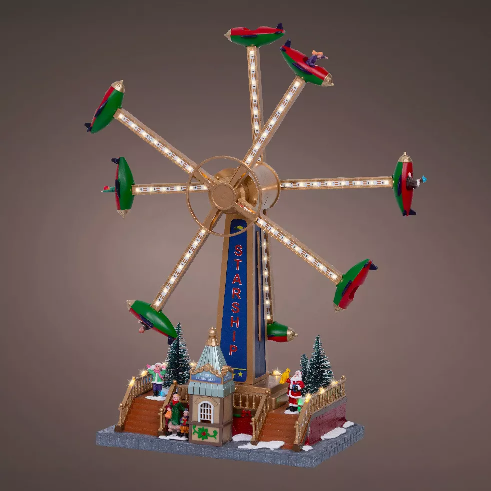 Pueblo de Navidad luminoso, animado y musical (H47 cm) Carrusel de aviones