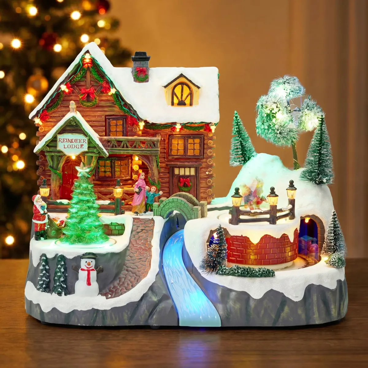 Villaggio di Natale animato e musicale a pile (H28 cm) Il chalet e il treno
